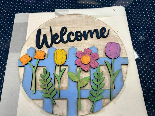 Wall or door hanger with picket fence and flowers with  "Welcome"
